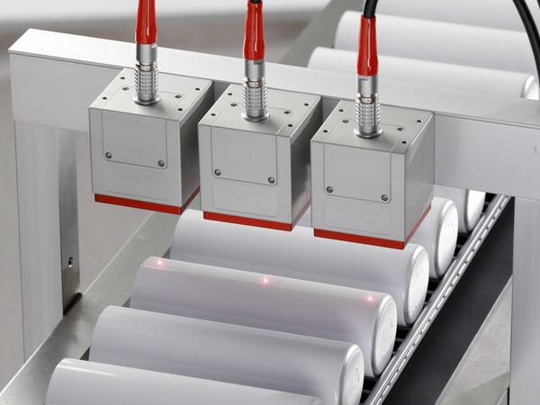 Three PaintChecker Industrial Cubes measure coating thickness of aluminum sleeves